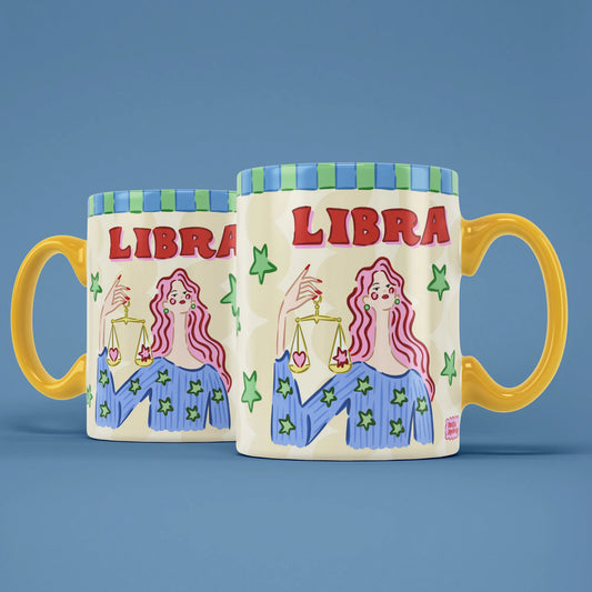 Two Libra star sign mugs showing a pink-haired figure holding golden balance scales