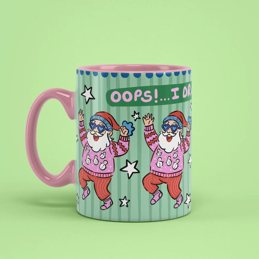Oops Santa Mug – funny Christmas cup with pink handle on left
