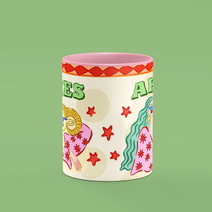 Aries mug reverse view showing red stars and floral details and pink handle