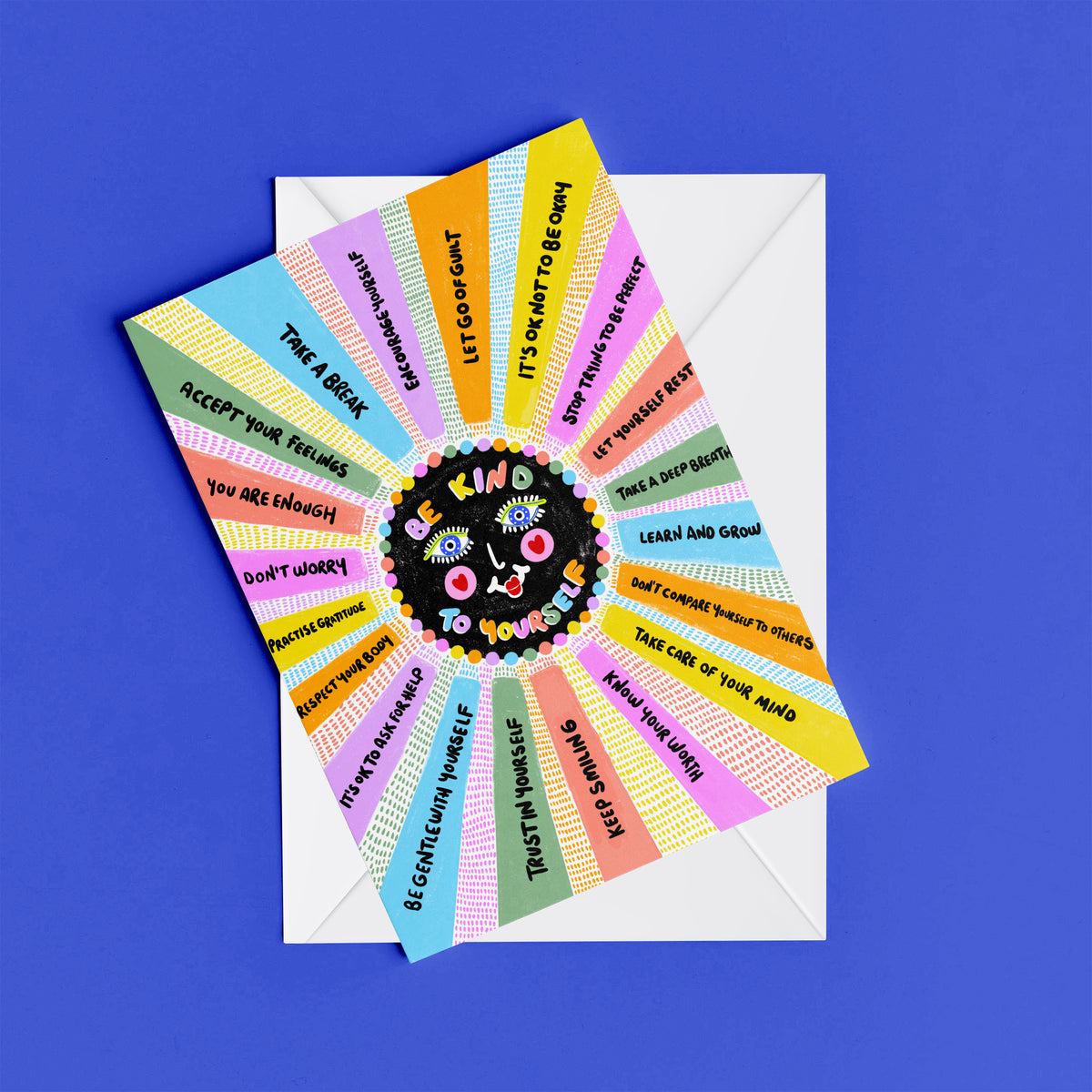 Be Kind to Yourself print – flat lay mock-up showing the colourful illustrated design