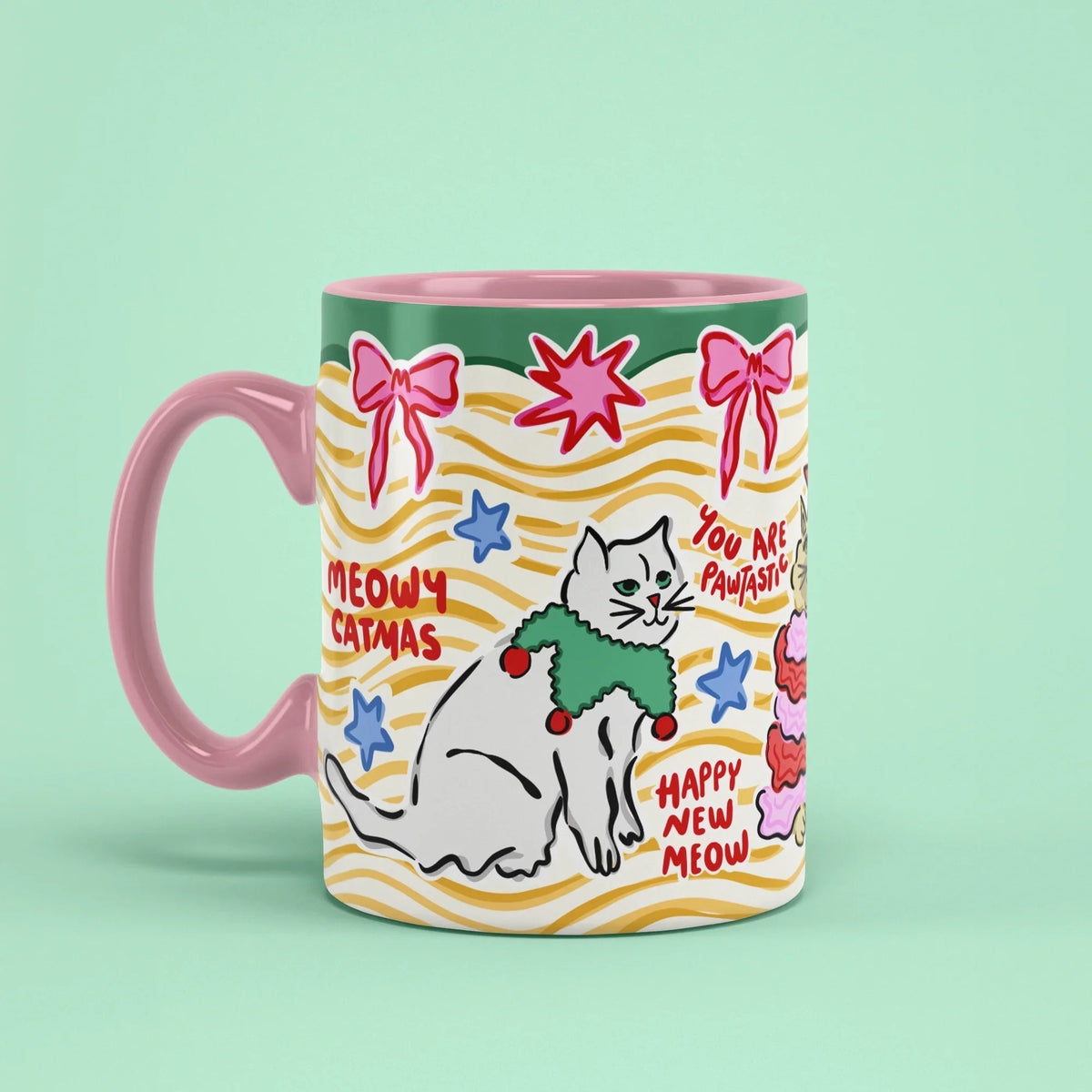 Catmas Mug – Christmas cat cup with pink handle on left