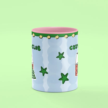 Cozy Home Club Mug – front view of winter cottage illustration