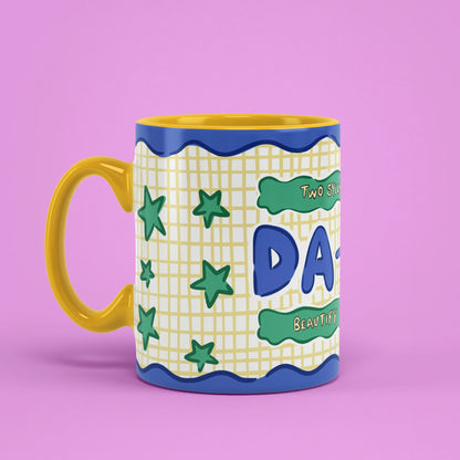 Left view of Da-Da Mug with blue bubble letters and stars