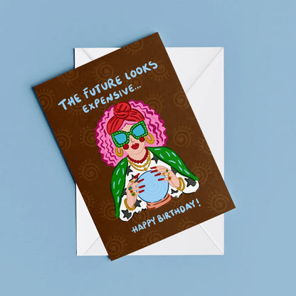 The Future Looks Expensive Card – card resting on its envelope