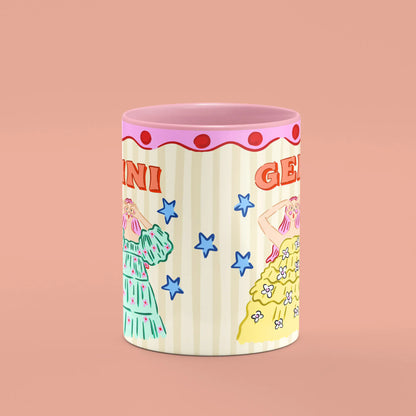 Gemini mug reverse view showing blue stars and colourful figures and pink handle