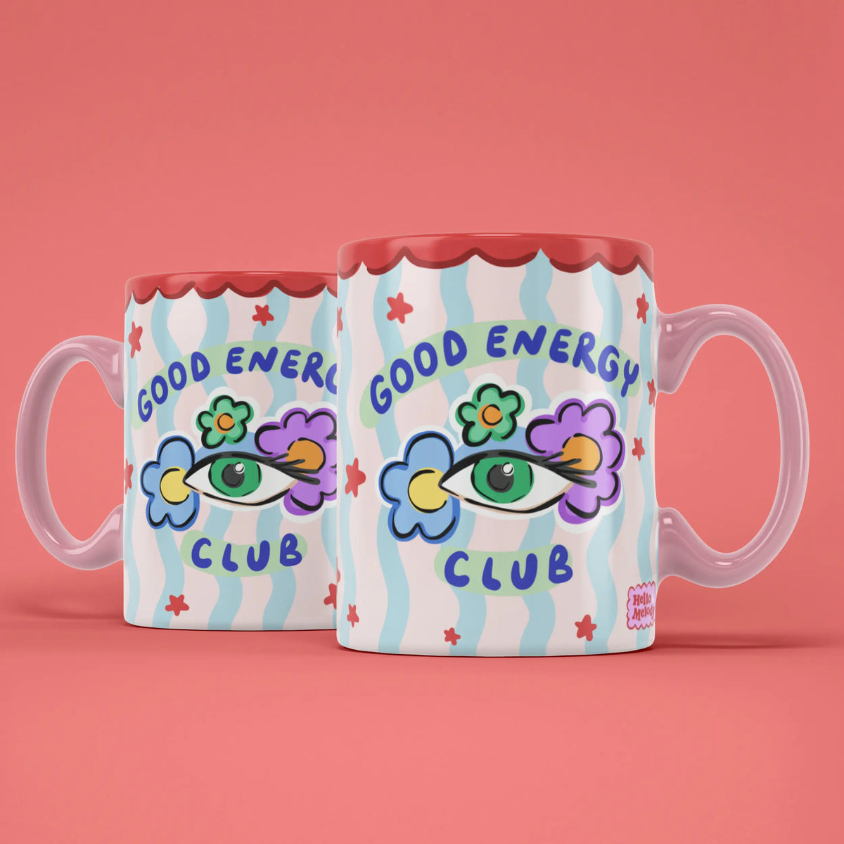 Two Good Energy Club mugs showing both sides of the positive energy design