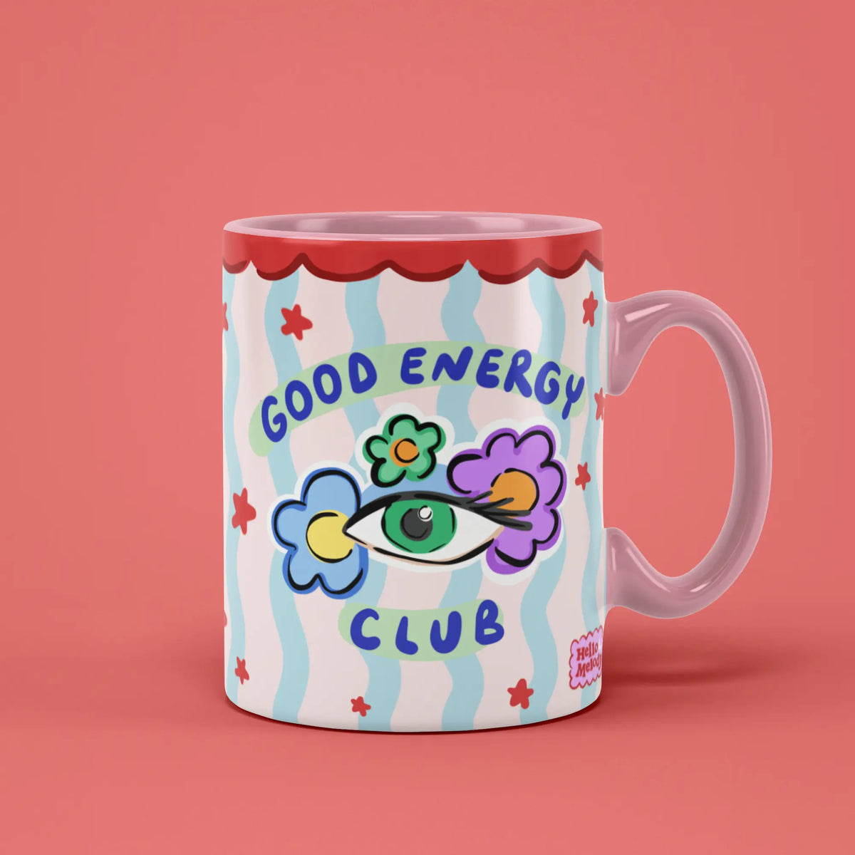 Good Energy Club Mug with colourful flower artwork and a pink handle