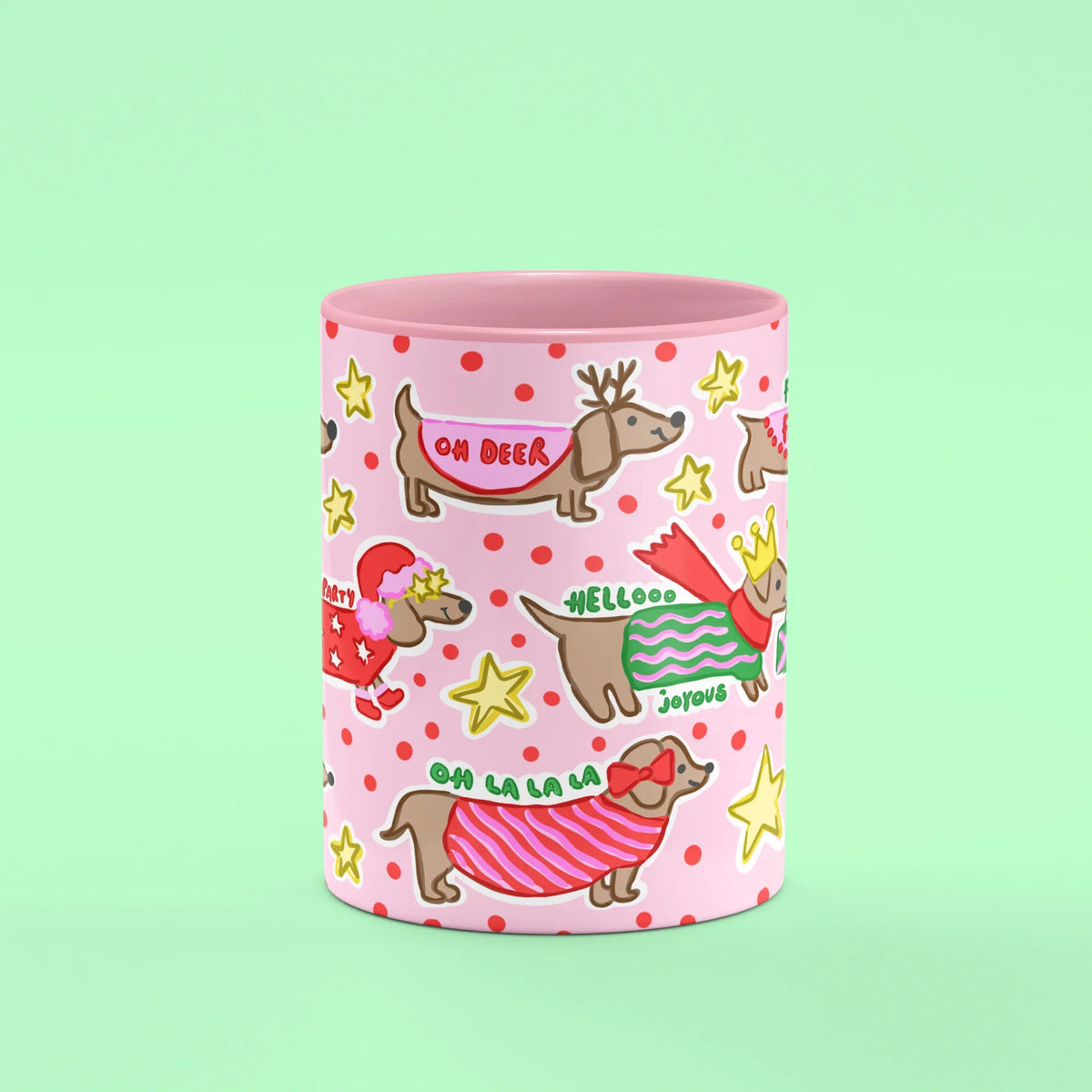 Ho Ho Ho Sausage Dog Mug – front view of sausage dogs in festive knits on pink
