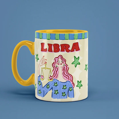 Libra astrology mug angled left with green stars and golden scales