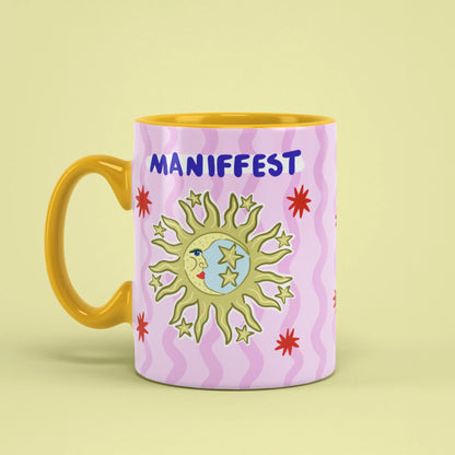 Manifest Mug – celestial cup with yellow handle on left