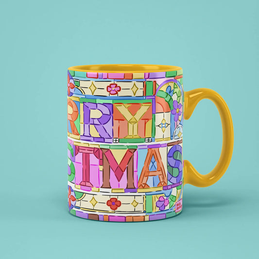 Merry Christmas Mosaic Mug with colourful tiled lettering and a yellow handle