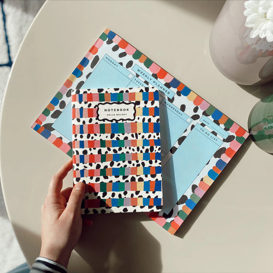 Rainbow Notebook with colourful striped cover and dalmatian-inspired pattern