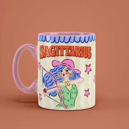 Sagittarius astrology mug angled left with pink stars and archer artwork