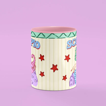 Scorpio mug reverse view showing red stars and scorpion artwork and pink handle
