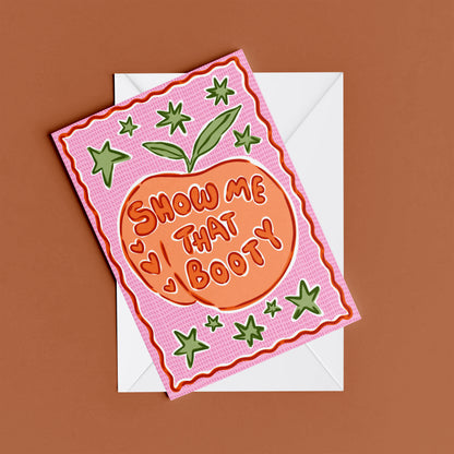 Show Me That Booty print – flat lay mock-up showing the colourful illustrated design