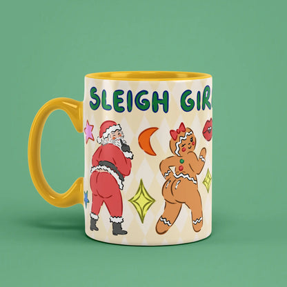 Sleigh Mug with Santa and elf illustrations and a yellow handle on the left
