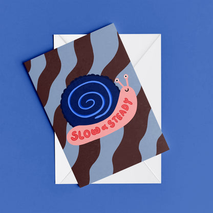 Slow and Steady print – flat lay mock-up showing the colourful illustrated design