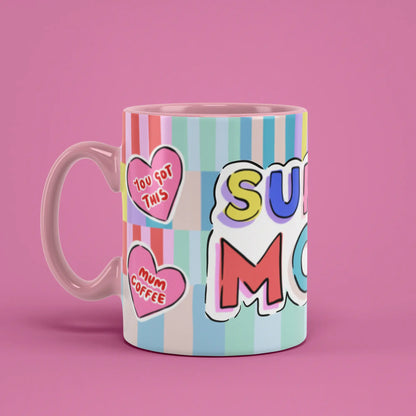 Super Mom Mug with playful heart artwork and a pink handle on the left