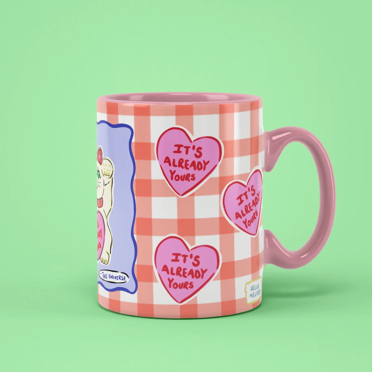The Universe Mug – It's Already Yours hearts on gingham, pink handle on right