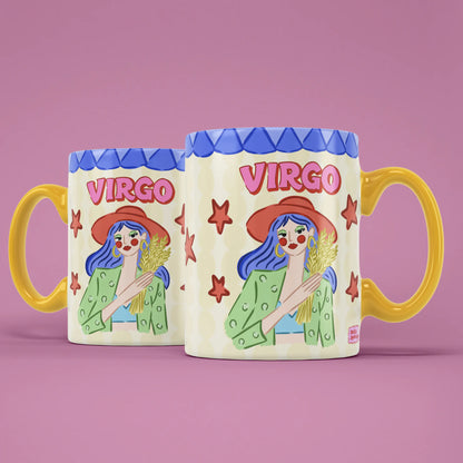 Two Virgo star sign mugs showing a red-beret-wearing figure holding golden wheat