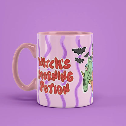 Morning Potion Mug with an illustrated witch and a pink handle on the left