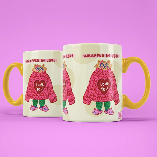 Wrapped in Love Mug – two mugs showing the front and back of the cosy cat design
