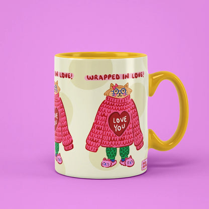 Wrapped in Love Mug – cat in a red knitted jumper, yellow handle on right